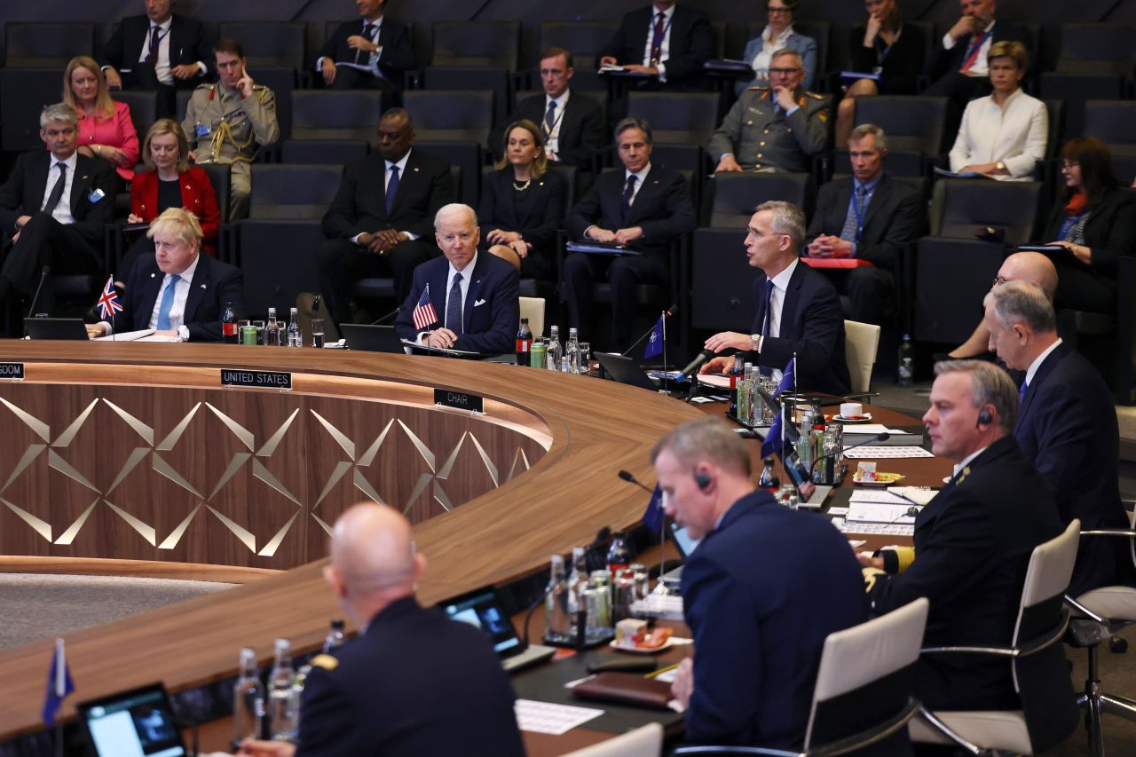 US President Joe Biden is seated second from left, between British Prime Minister Boris Johnson and NATO Secretary General Jens Stoltenberg as Stoltenberg speaks at a NATO summit in Brussels, Belgium, on Thursday, March 24. "We gather at a critical time for our security," Stoltenberg said as the meeting convened. "We are determined to continue to impose costs on Russia to bring about an end to this brutal war." <a href="http://www.cnn.com/2022/03/24/politics/gallery/biden-trip-belgium-poland/index.html" target="_blank">See more photos from Biden's high-stakes trip to Europe.</a>