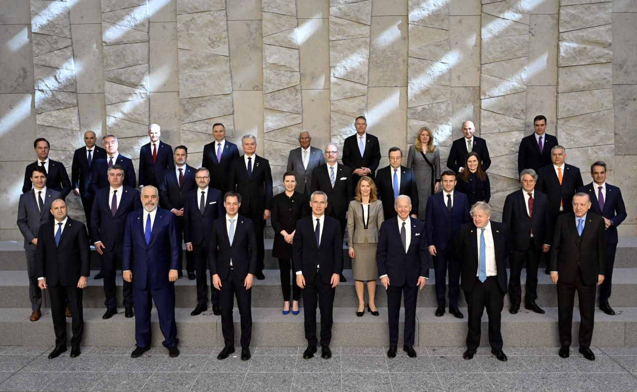 Biden and other world leaders pose for a group picture at the NATO summit on Thursday. Biden is in the front row, third from right.