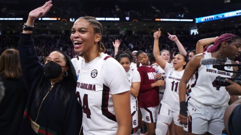 South Carolina guard LeLe Grissett (24) and head coach Dawn Staley celebrate after a second-round game against Miami in the NCAA college basketball tournament on March 20, 2022.