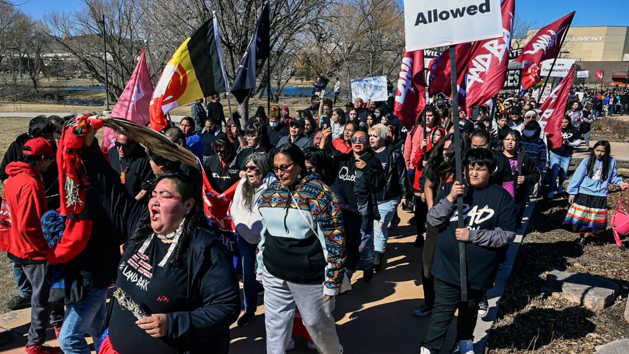 Indigenous rights activists and others marched in Rapid City, South Dakota, on Wednesday after a local hotel was accused of declining to serve Native Americans.
