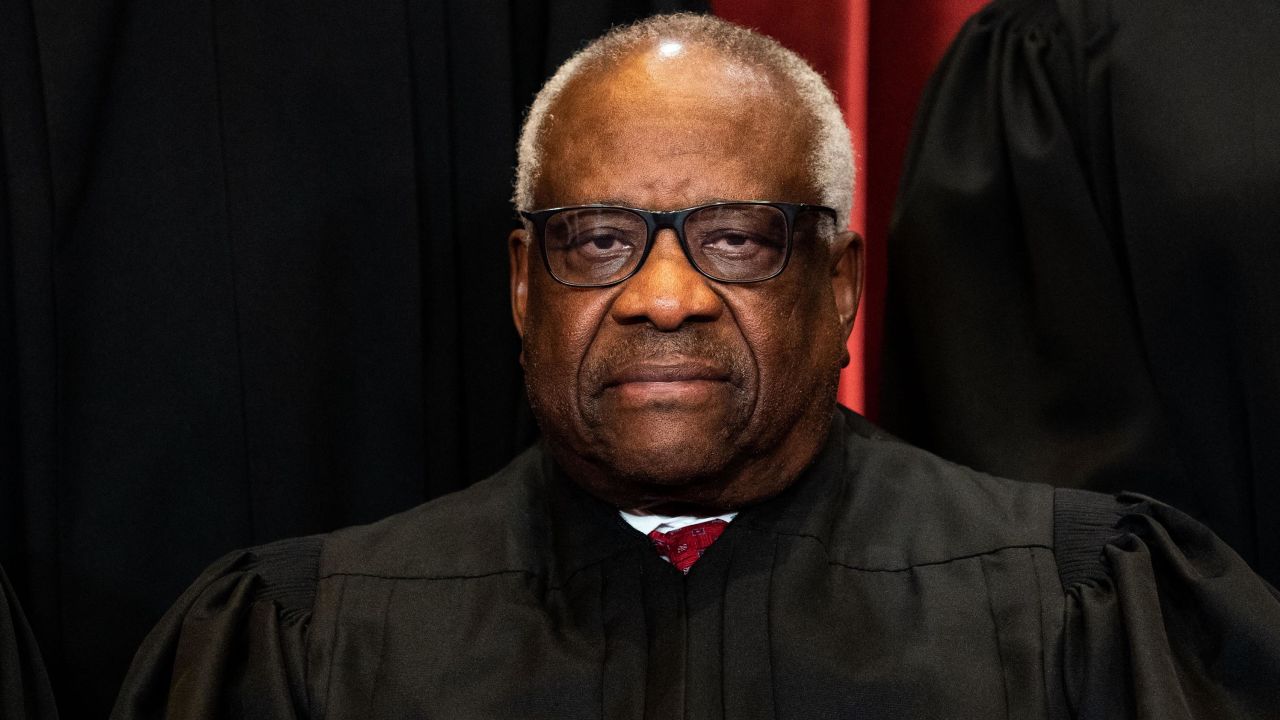Associate Justice Clarence Thomas sits during a group photo of the Justices at the Supreme Court in Washington, DC on April 23, 2021.