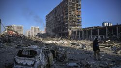 A Ukranian serviceman walks between debris outside the destroyed Retroville shopping mall in a residential district after a Russian attack on the Ukranian capital Kyiv on March 21, 2022. - At least six people were killed in the overnight bombing of a shopping centre in the Ukrainian capital Kyiv, an AFP journalist said, with rescuers combing the wreckage for other victims. (Photo by ARIS MESSINIS / AFP) (Photo by ARIS MESSINIS/AFP via Getty Images)