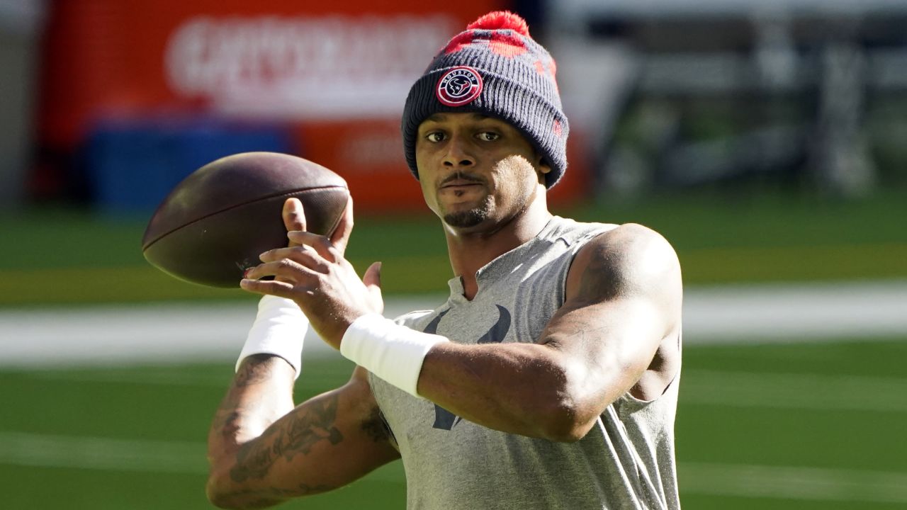Deshaun Watson, shown warming up before an NFL game  in 2021, still faces 22 civil complaints.