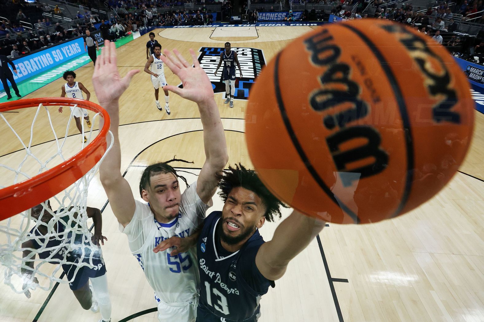 St. Peter's Isiah Dasher fends off Kentucky's Lance Ware during their first-round game at the NCAA Tournament on Thursday, March 17. St. Peter's defeated Kentucky 85-79 in overtime. It was <a href="index.php?page=&url=https%3A%2F%2Fwww.cnn.com%2F2022%2F03%2F18%2Fsport%2Fsaint-peters-kentucky-march-madness-spt-intl%2Findex.html" target="_blank">the tournament's biggest upset this year,</a> as St. Peter's was a 15-seed and Kentucky was a 2-seed.