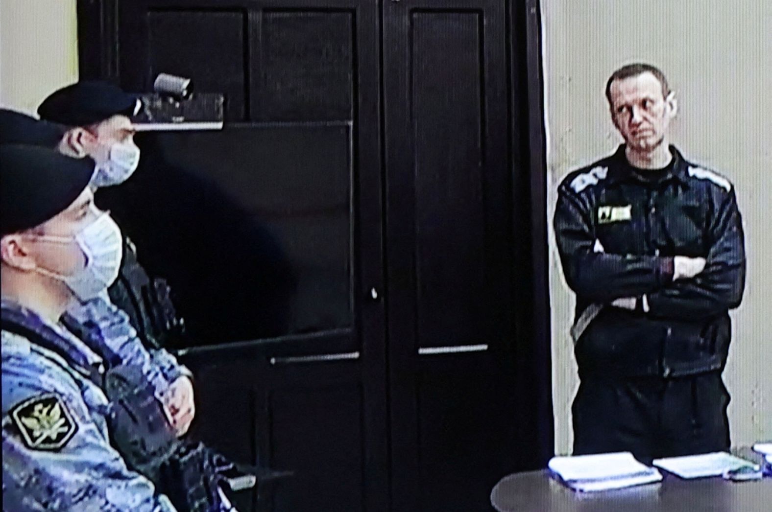 Russian opposition leader Alexei Navalny, right, appears at a court hearing in this screengrab taken from video on Tuesday, March 22. He was <a href="index.php?page=&url=https%3A%2F%2Fwww.cnn.com%2F2022%2F03%2F22%2Feurope%2Falexey-navalny-fraud-conviction-russia-intl-hnk%2Findex.html" target="_blank">sentenced to nine years in a maximum-security jail,</a> according to the Russian state-owned news agency Tass. He had been convicted on fraud charges by Moscow's Lefortovo court over allegations that he stole from his Anti-Corruption Foundation. His lawyer said he would appeal the guilty verdict.