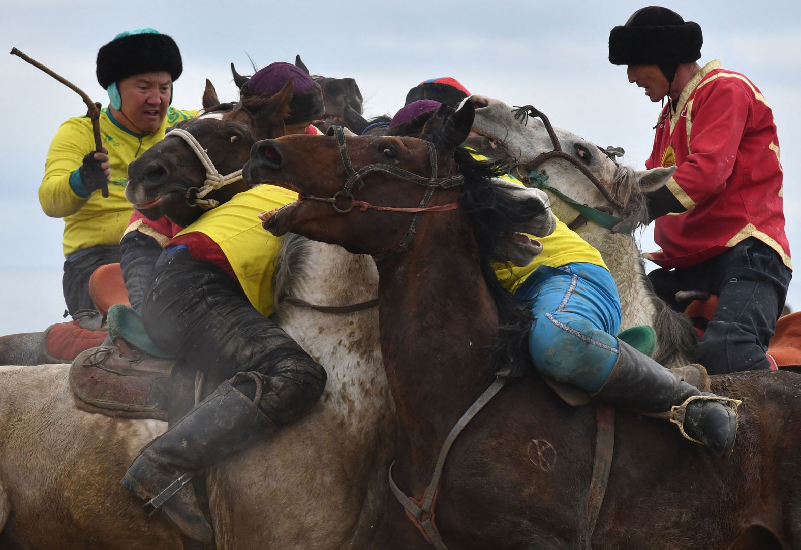 Horsemen play buzkashi during Persian New Year celebrations in Cholpon-Ata, Kyrgyzstan, on Friday, March 18. In buzkashi, players compete to place a goat carcass into a goal circle.