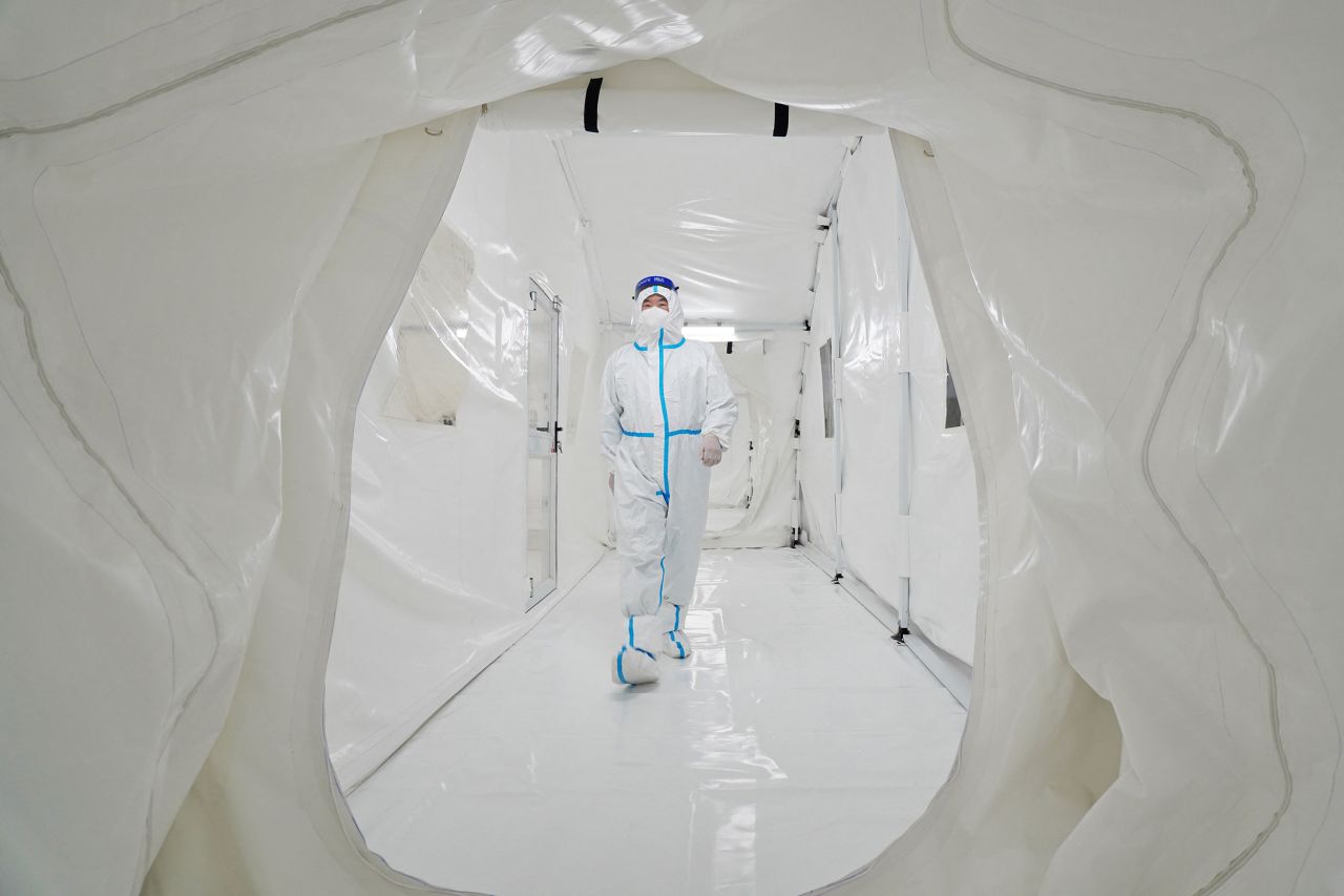 A staff member walks inside the Fire Eye laboratory, a temporary Covid-19 testing facility, before it opened in Yantai, China, on Thursday, March 17.