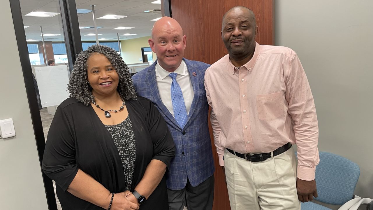 Mason Vice mayor Virginia Rivers, left, and Mayor Emmit Gooden, right, pose for a photo with comptroller Jason Mumpower, center.