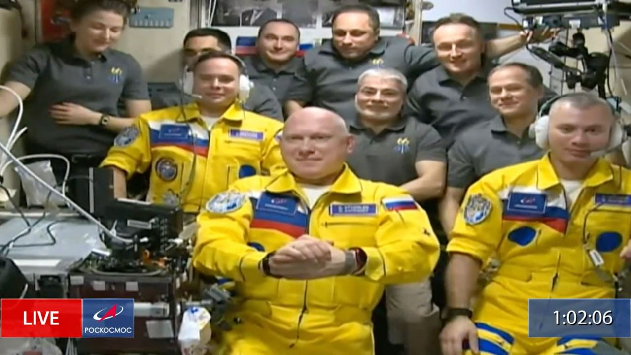 In this screen grab taken from video, Russian cosmonauts Sergey Korsakov, Oleg Artemyev and Denis Matveyev are welcomed after arriving at the International Space Station on Friday, March 18. Their yellow flight suits, trimmed with blue, <a href="https://www.cnn.com/2022/03/19/politics/russian-cosmonauts-ukraine-international-space-station/index.html" target="_blank">raised questions</a> about whether the three were showing solidarity with Ukraine by wearing its national colors. The head of Roscosmos, the Russian space agency, said the crew were not representing Ukraine but wearing colors from their alma mater: Bauman Moscow State Technical University.