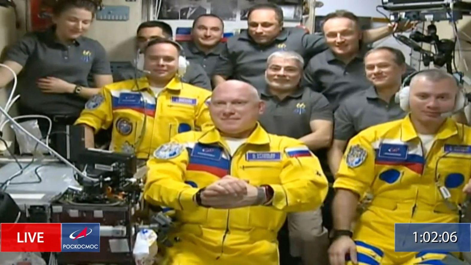 In this screen grab taken from video, Russian cosmonauts Sergey Korsakov, Oleg Artemyev and Denis Matveyev are welcomed after arriving at the International Space Station on Friday, March 18. Their yellow flight suits, trimmed with blue, <a href="index.php?page=&url=https%3A%2F%2Fwww.cnn.com%2F2022%2F03%2F19%2Fpolitics%2Frussian-cosmonauts-ukraine-international-space-station%2Findex.html" target="_blank">raised questions</a> about whether the three were showing solidarity with Ukraine by wearing its national colors. The head of Roscosmos, the Russian space agency, said the crew were not representing Ukraine but wearing colors from their alma mater: Bauman Moscow State Technical University.
