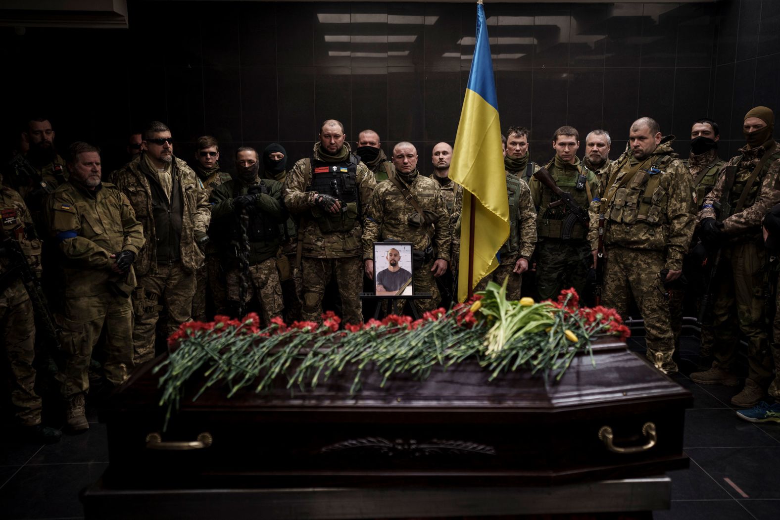 Ukrainian servicemen attend the funeral of Alexandr Khovtun in Kyiv, Ukraine, on Sunday, March 20. Khovtun died in combat in the town of Huta-Mezhyhirska.