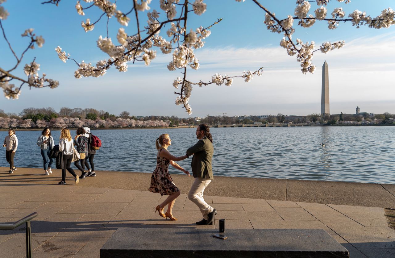 Laura Gingrich and Matthew Poetzinger dance near Yoshino cherry trees as they celebrate their engagement in Washington, DC, on Tuesday, March 22. The city's iconic cherry blossoms were in full bloom. <a href="http://www.cnn.com/2022/03/17/world/gallery/photos-this-week-march-10-march-17/index.html" target="_blank">See last week in 35 photos.</a>