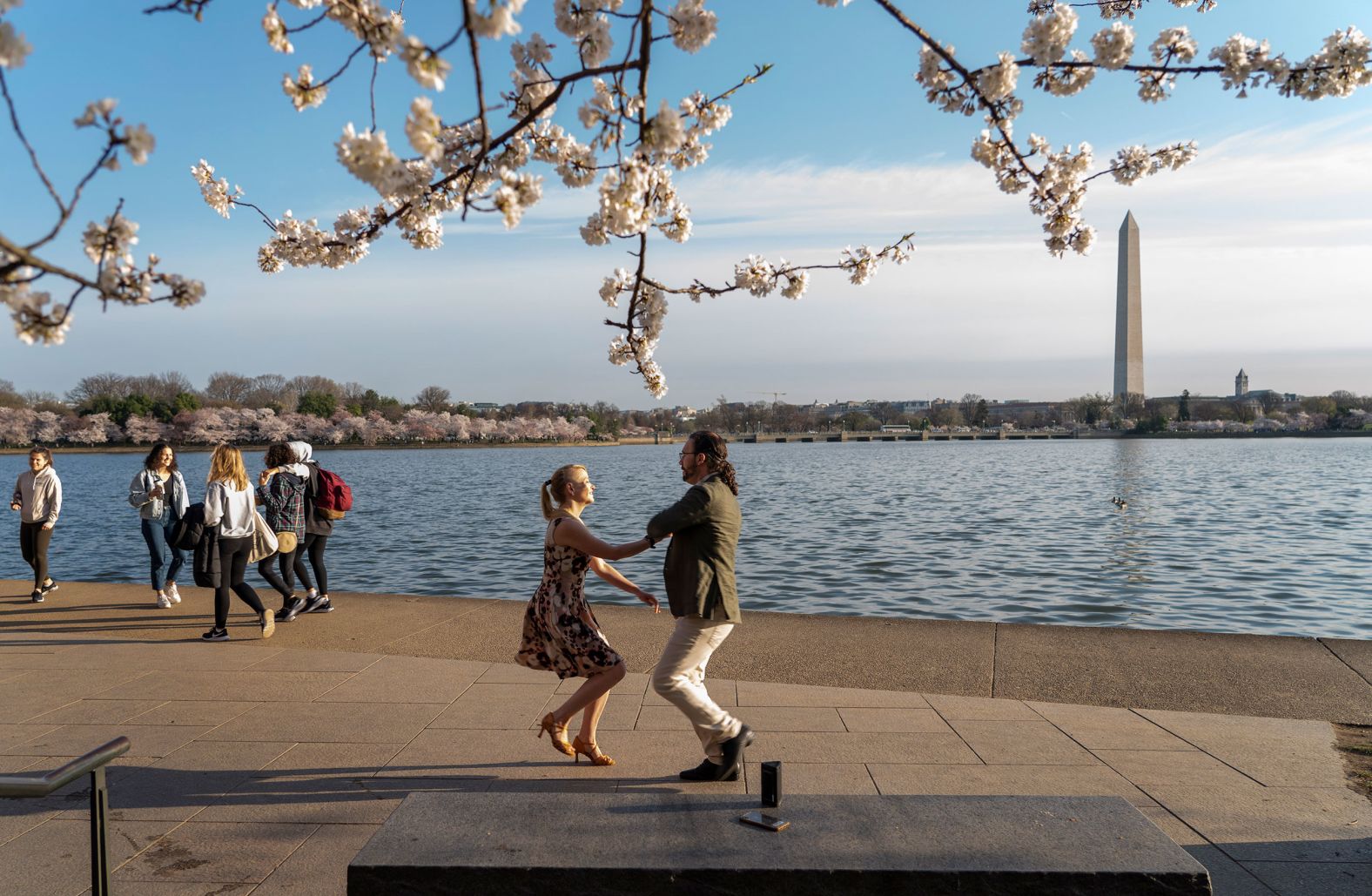Laura Gingrich and Matthew Poetzinger dance near Yoshino cherry trees as they celebrate their engagement in Washington, DC, on Tuesday, March 22. The city's iconic cherry blossoms were in full bloom. <a href="index.php?page=&url=http%3A%2F%2Fwww.cnn.com%2F2022%2F03%2F17%2Fworld%2Fgallery%2Fphotos-this-week-march-10-march-17%2Findex.html" target="_blank">See last week in 35 photos.</a>
