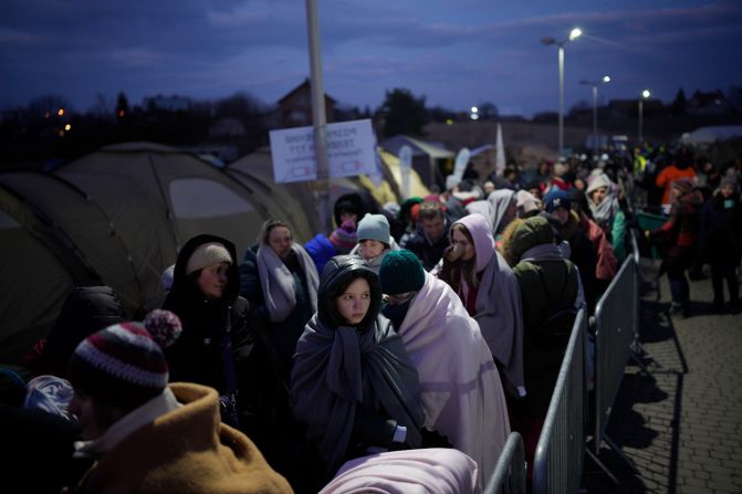 <strong>On the road to safety: </strong>Refugees at the Medyka border crossing, Poland.