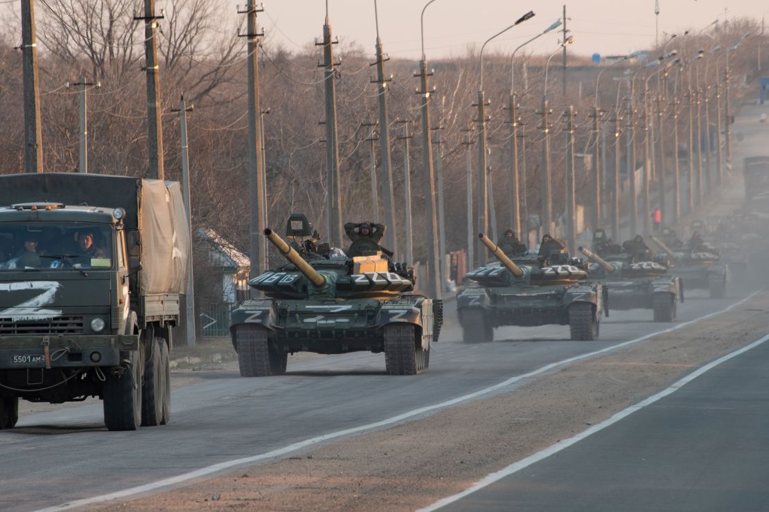 A column of Russian military vehicles proceeds northwards along the Mariupol-Donetsk highway.