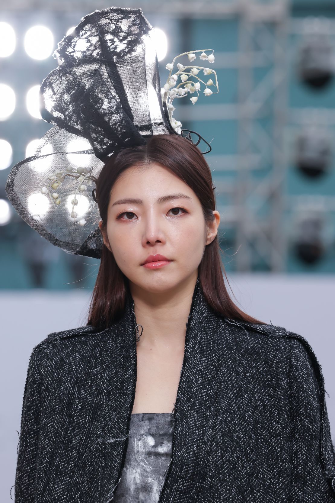 C-ZANN E is a brand inspired by minimalism and traditional Korean hanbok. Models wore ornate headpieces down the runway.