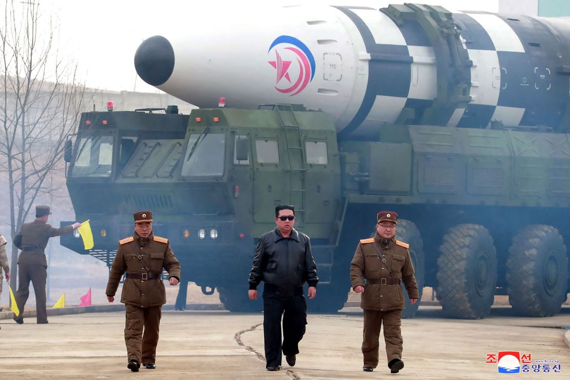 This picture by North Korea's official Korean Central News on March 25 purportedly shows leader Kim Jong Un walking near what state media reported was a new type intercontinental ballistic missile. Experts doubt the claims.