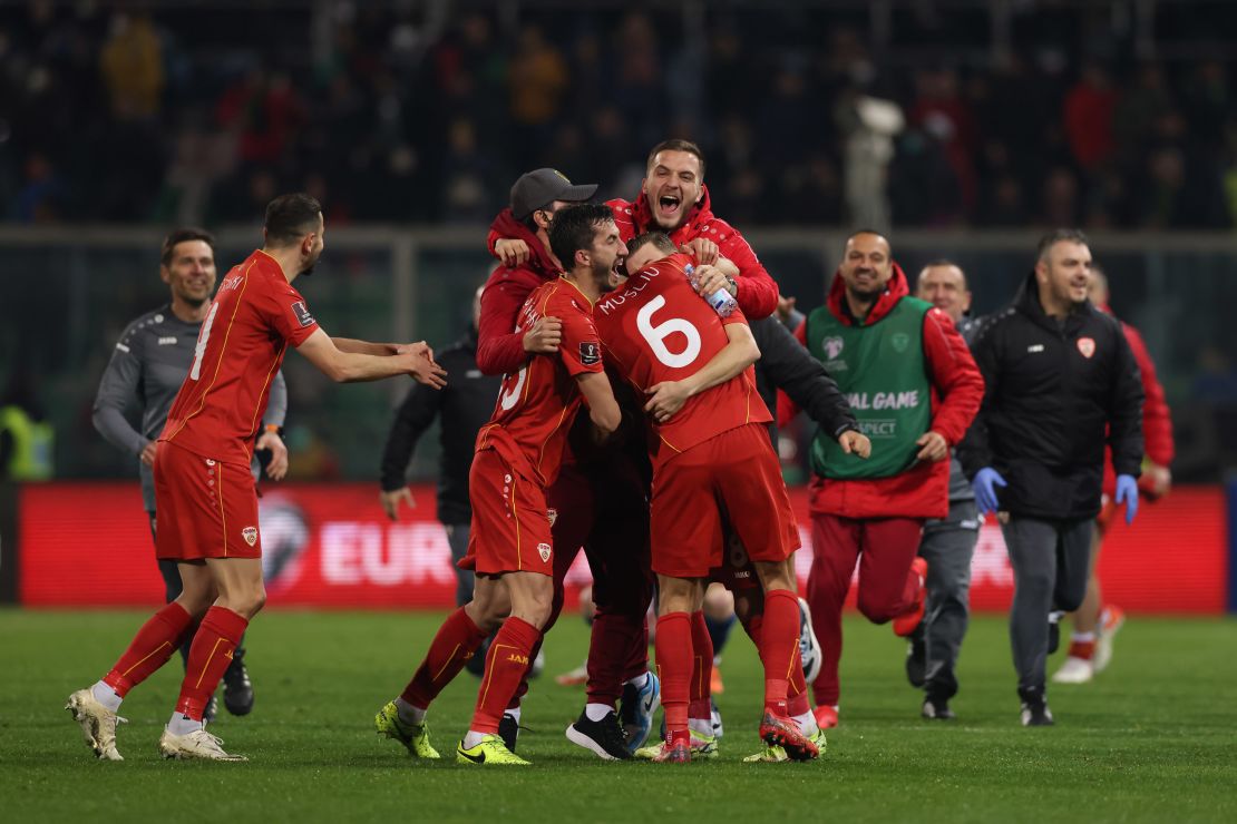 North Macedonia players celebrate beating Italy. 