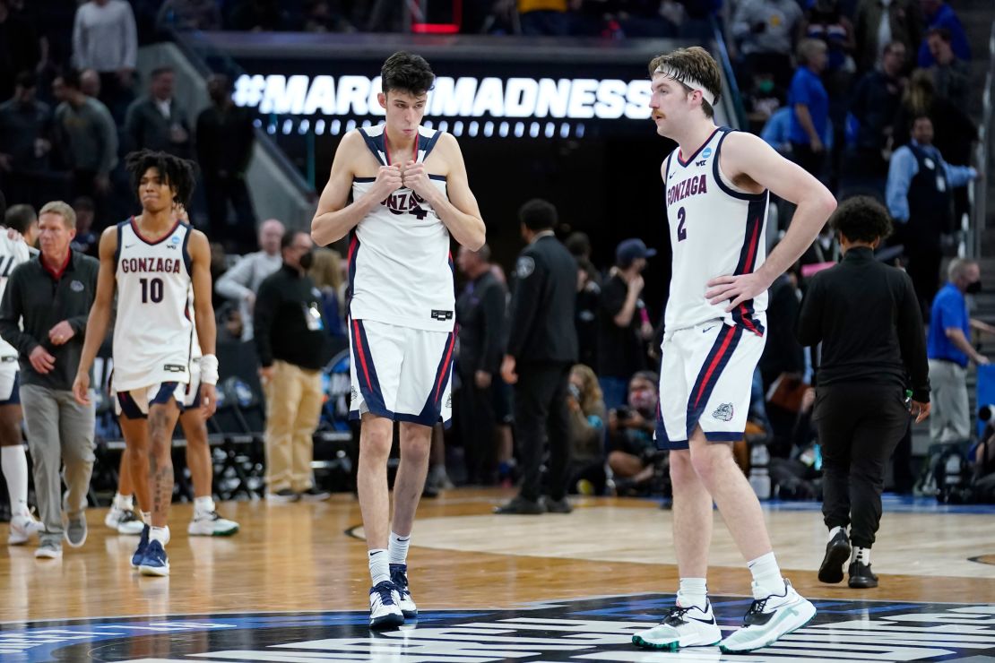 Guard Hunter Sallis, center Chet Holmgren and forward Drew Timme react after Gonzaga was defeated by Arkansas.