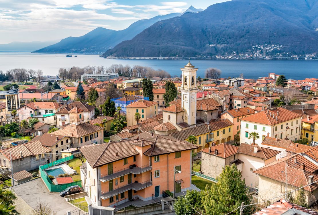 Jo Mackay's properties sit in the hills above Luino (pictured) on Lake Maggiore.