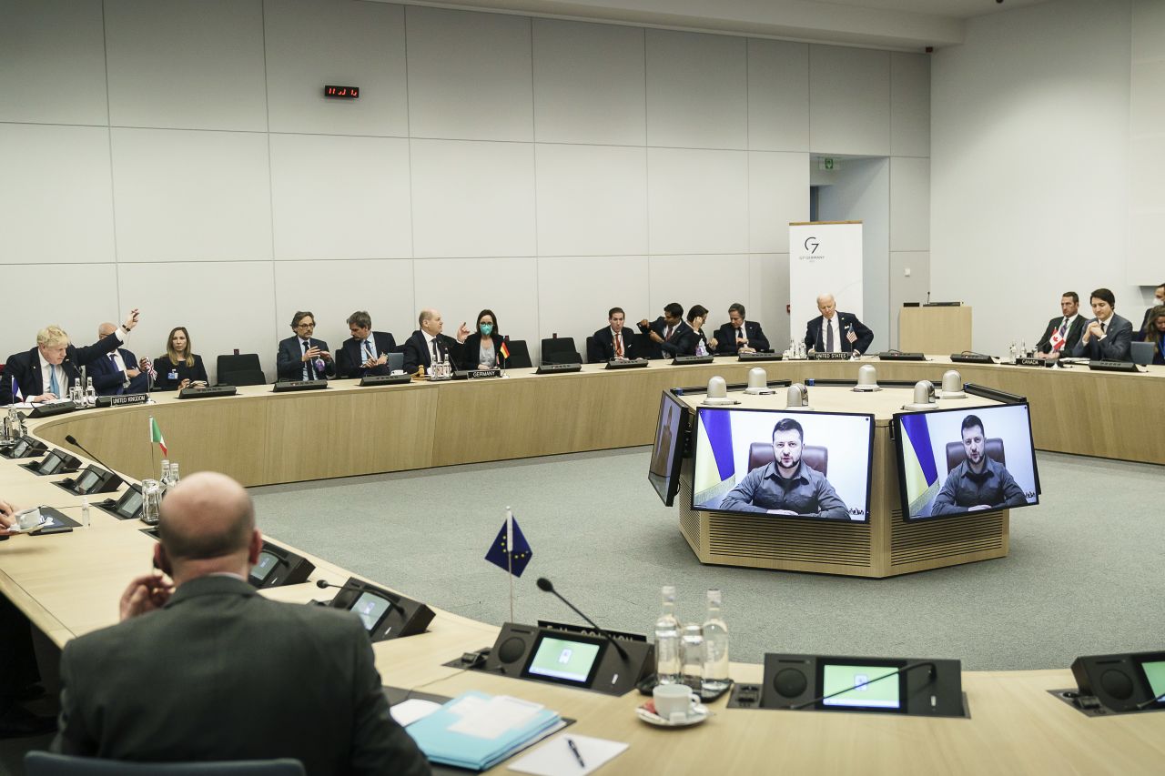 Ukrainian President Volodymyr Zelensky addresses world leaders via video at the NATO summit in Brussels, Belgium, on March 24. Zelensky stopped short of issuing his usual request for a no-fly zone, but he did say Ukraine needs fighter jets, tanks and better air defenses.  Zelensky says Russia waging war so Putin can stay in power &#8216;until the end of his life&#8217; 220325080511 03 ukraine gallery update