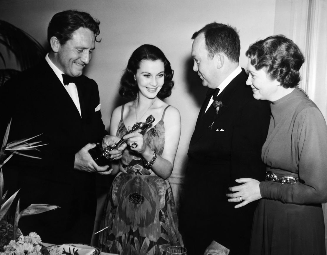 From left: Spencer Tracy and Vivien Leigh holding her Best Actress Academy Award for "Gone with the Wind," as Thomas Mitchell and Fay Bainter look on, following the awards ceremony in Los Angeles on February 29, 1940.