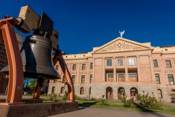 PHOENIX ARIZONA, Replica of Liberty Bell in front of Arizona State Capitol Building at sunrise. (Photo by: Joe Sohm/Visions of America/Universal Images Group via Getty Images)