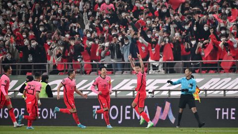 South Korea's Kim Young-gwon celebrates his goal in front of fans.
