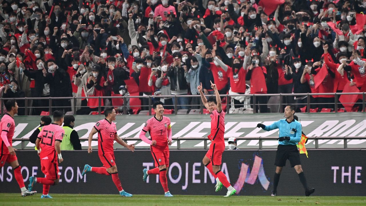 South Korea's Kim Young-gwon celebrates his goal in front of fans. 