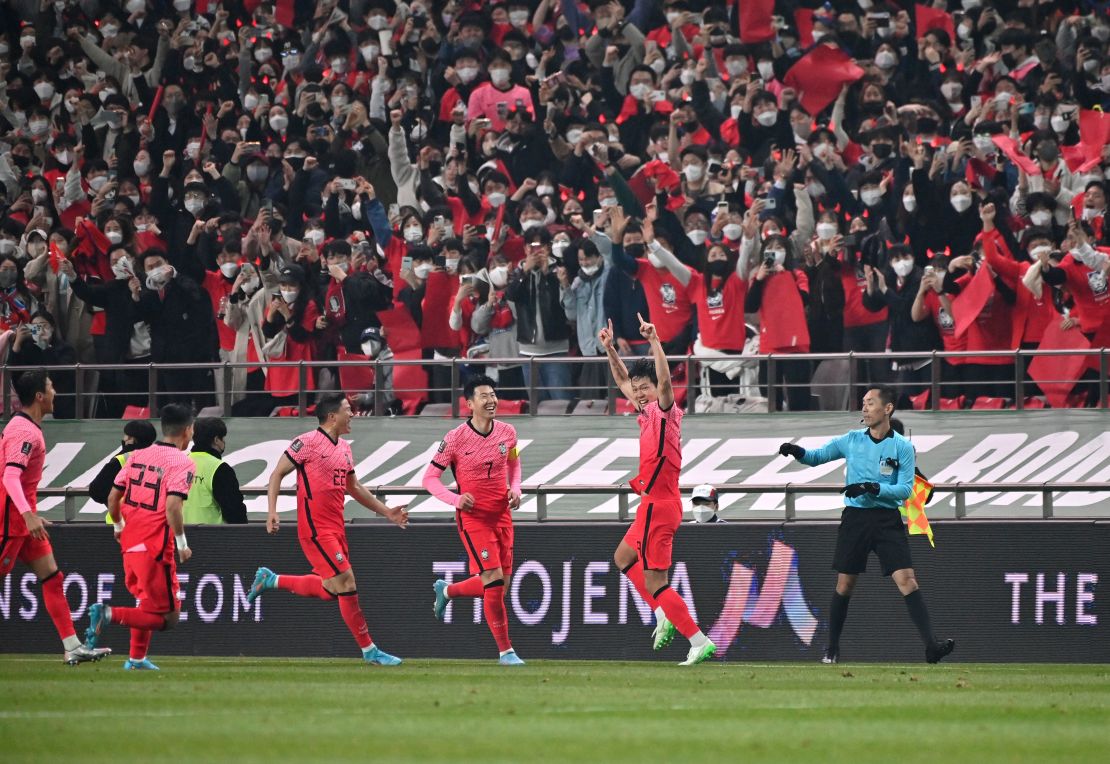 South Korea's Kim Young-gwon celebrates his goal in front of fans. 