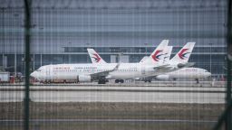 Passenger aircraft, operated by China Eastern Airlines Co., sit grounded at Pudong International Airport in Shanghai, China, on Tuesday, March 10, 2020.