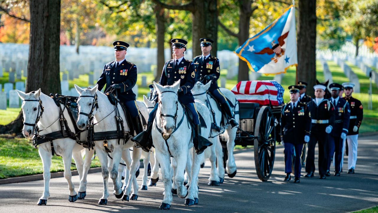 In this November 5, 2021, file photo, the 3rd US Infantry Regiment Caisson Platoon and an Armed Forces Body Bearer Team honor the late retired Gen. Colin Powell during a special military funeral at Arlington National Cemetery, in Arlington, Virginia.