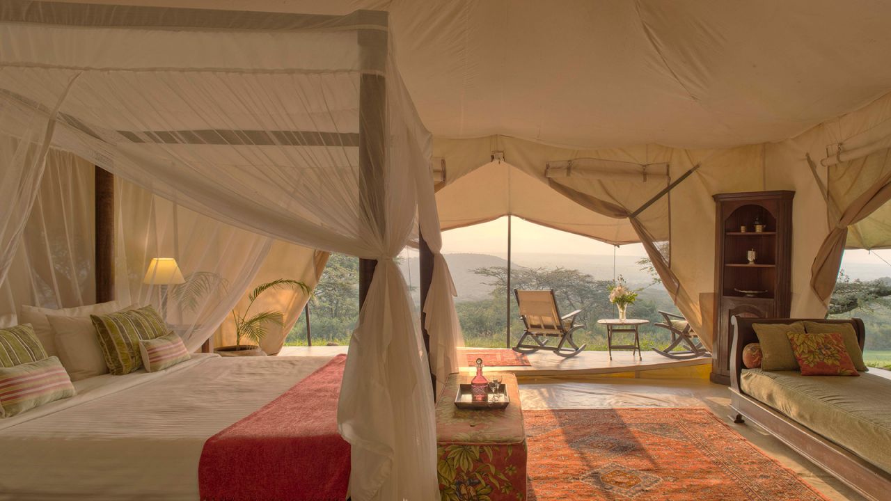 <strong>Luxury under canvas: </strong>There are ornate writing desks and four-poster beds in each bedroom, waiters carry silver trays of gins and tonic out to the pool before lunch, and long mahogany tables are laid for dinner, when guests are encouraged to dress up and mingle.