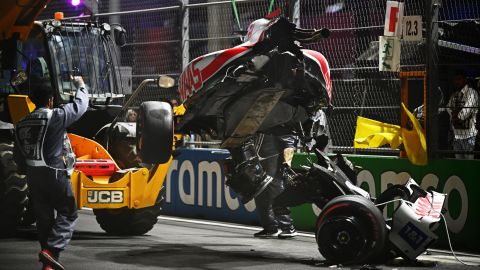 Track marshals clean debris from the track following Mick Schumacher's crash during qualifying ahead of the F1 Grand Prix of Saudi Arabia at the Jeddah Corniche Circuit on March 26, 2022, in Jeddah, Saudi Arabia.