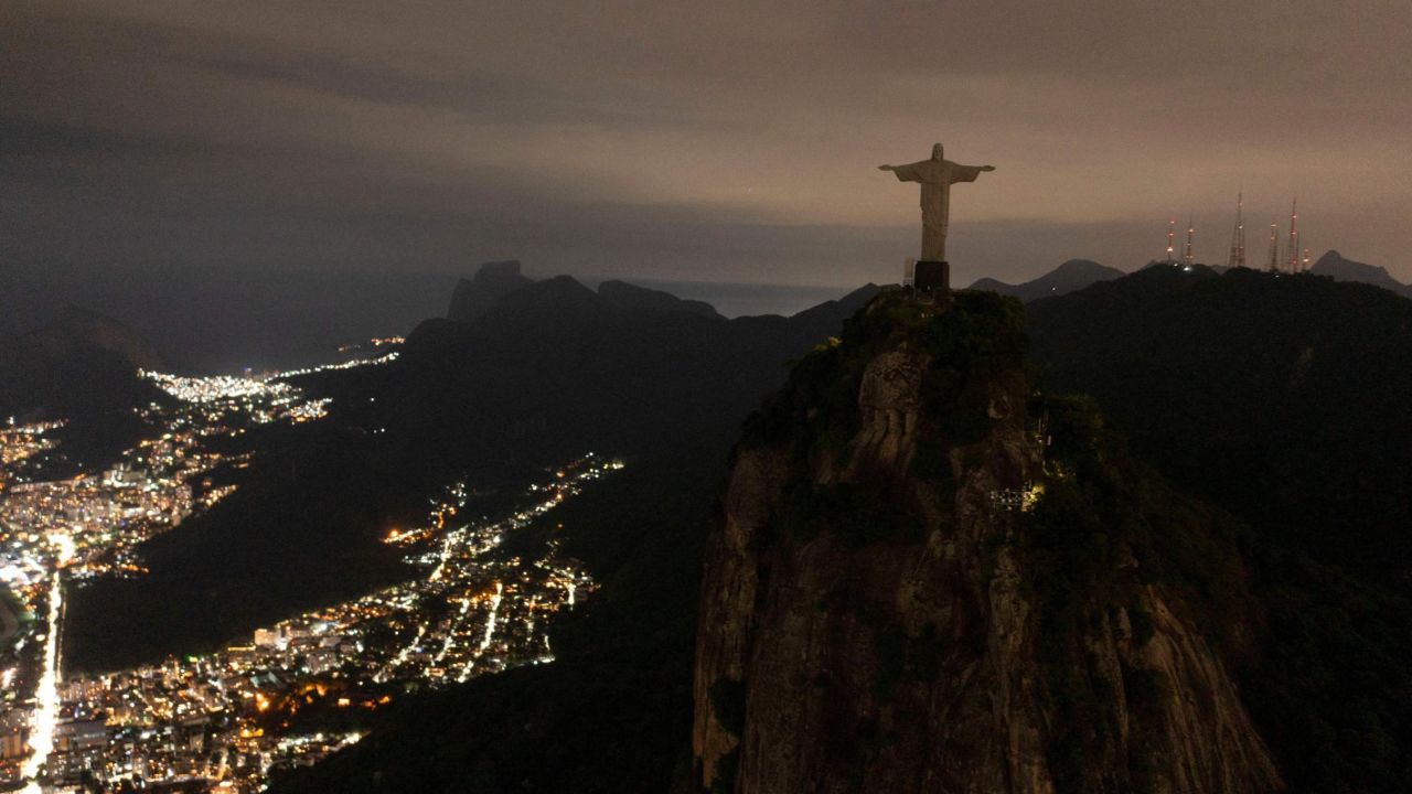 The statue of Christ the Redeemer is seen after being plunged into darkness for the Earth Hour environmental campaign on top of Corcovado hill in Rio de Janeiro, Brazil, on March 26, 2022. 