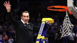 Head coach Mike Krzyzewski of the Duke Blue Devils climbs the ladder to cut down the net after defeating the Arkansas Razorbacks 78-69 during the second half in the NCAA Men's Basketball Tournament Elite 8 Round at Chase Center on March 26, 2022 in San Francisco, California. 