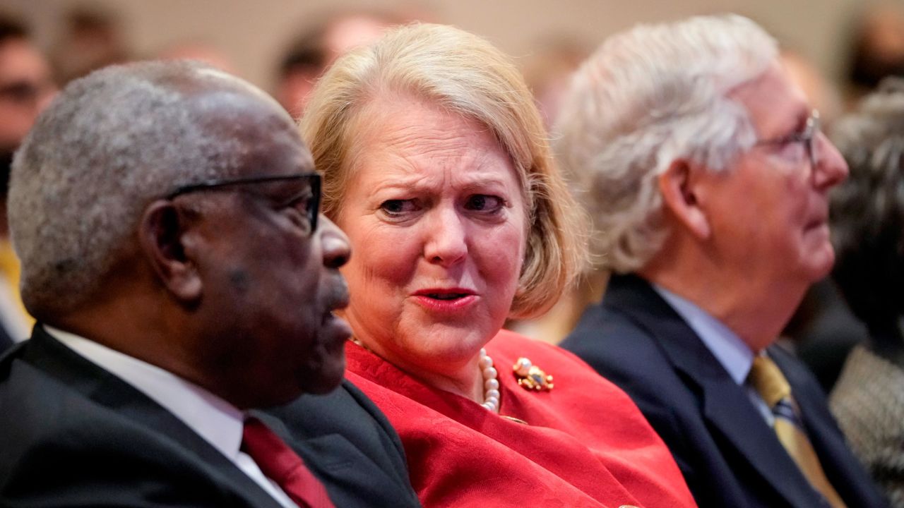 Associate Supreme Court Justice Clarence Thomas sits with his wife and conservative activist Virginia Thomas while he waits to speak at the Heritage Foundation on October 21, 2021.