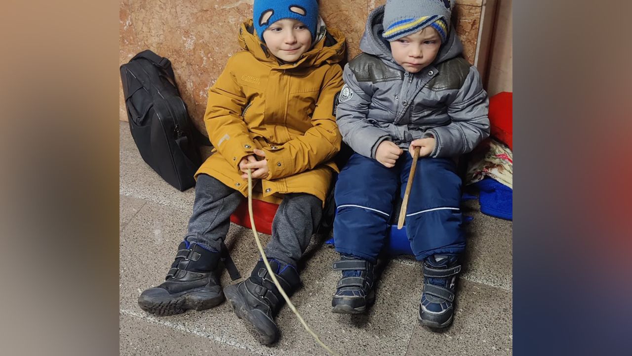 Brothers Milan and Edvard seek refuge in a Kyiv subway station on their wait to escape their hometown in Ukraine.
