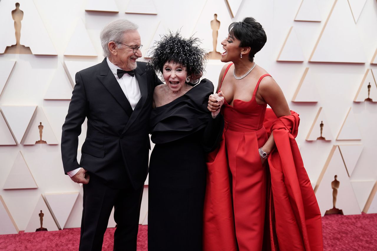 From left, director Steven Spielberg, actress Rita Moreno and Best Supporting actress winner Ariana DeBose. DeBose wore one of the night's many red-colored outfits, this time by Valentino.