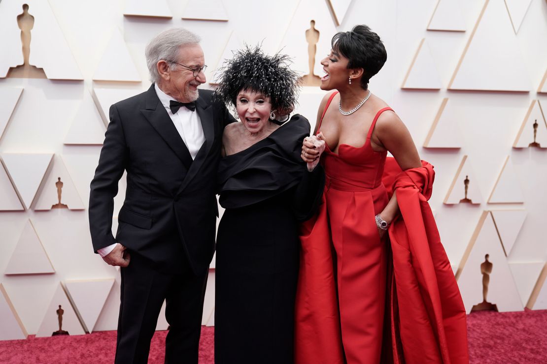 From left, director Steven Spielberg, actress Rita Moreno and Best Supporting actress winner Ariana DeBose. DeBose wore one of the night's many red-colored outfits, this time by Valentino.