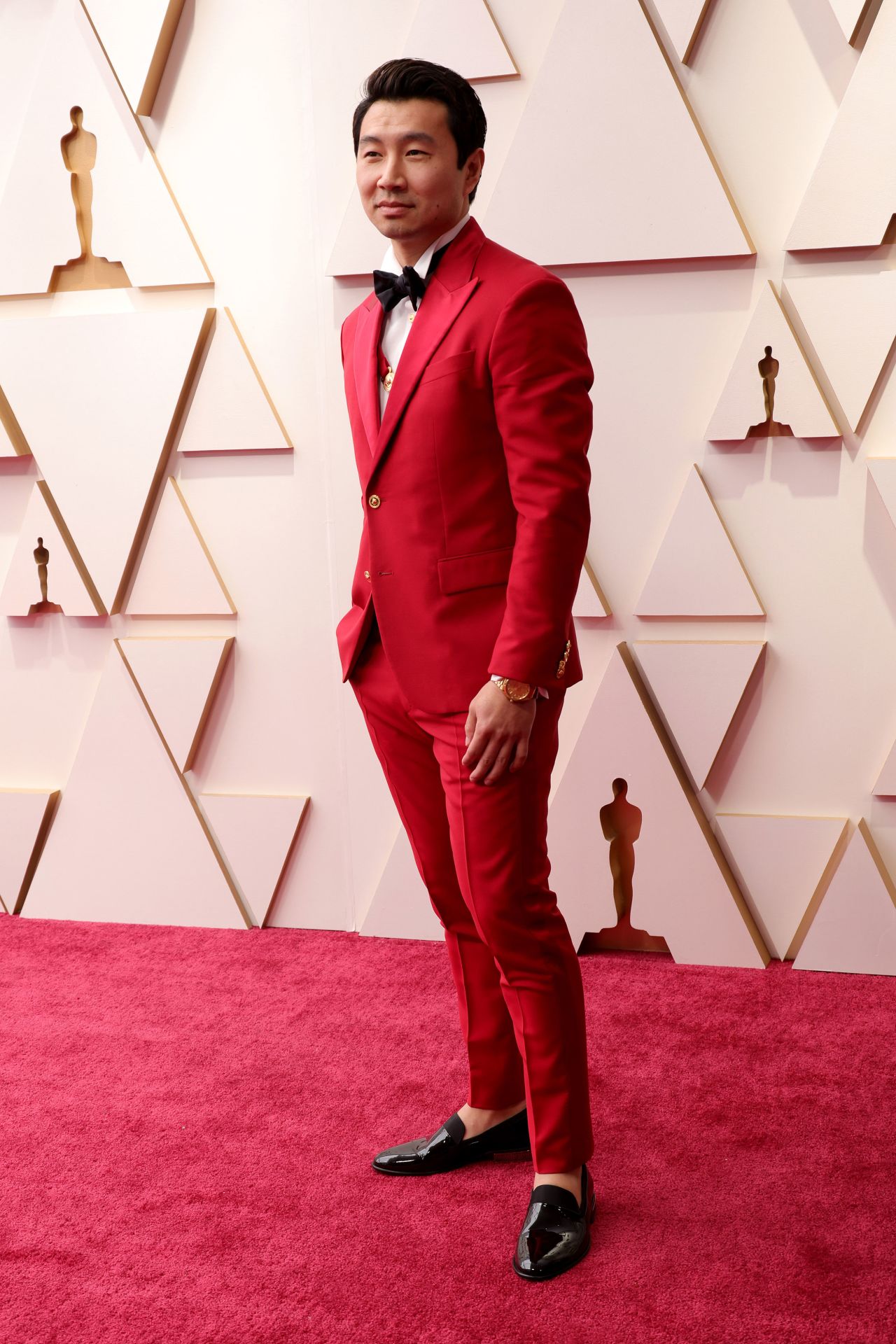 "Shang-Chi and the Legend of the Ten Rings" actor and Oscars presenter Simu Liu wore a red Versace suit with gold detailing. 
