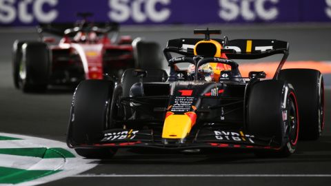 Verstappen drives in front of LeClerc. 