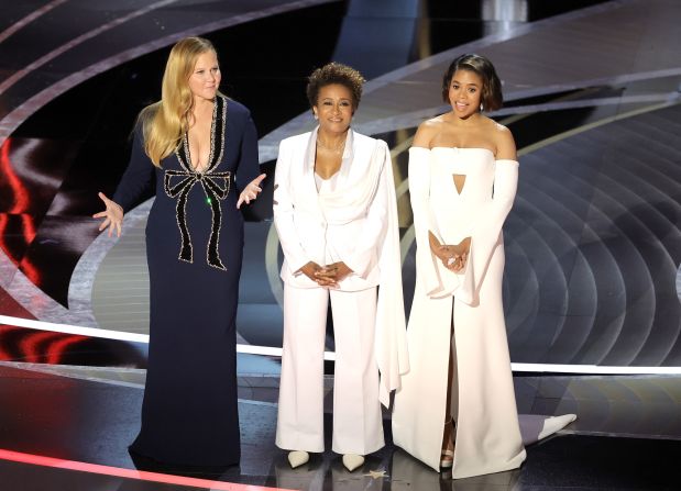 From left, Schumer, Sykes and Hall open the show. "This year the Academy hired three women to host because it's cheaper than hiring one man," <a href="index.php?page=&url=https%3A%2F%2Fwww.cnn.com%2Fentertainment%2Flive-news%2Foscars-2022%2Fh_c82e4b5f103b06fb28939559d21f5b39" target="_blank">Schumer joked.</a>