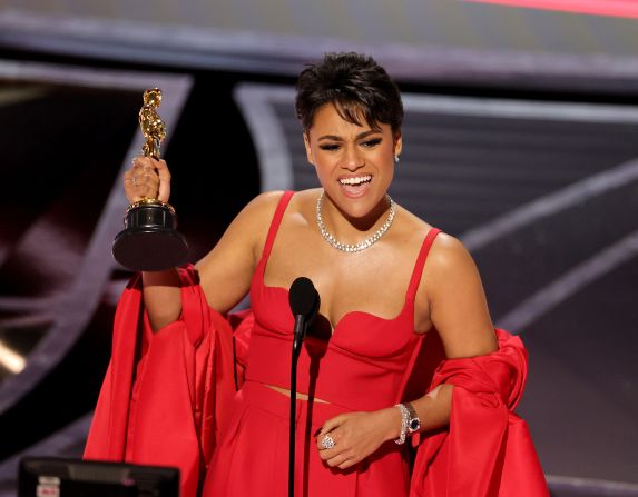 DeBose accepts the Oscar for best supporting actress. DeBose won for her role in the musical "West Side Story." She is <a href="index.php?page=&url=https%3A%2F%2Fwww.cnn.com%2Fentertainment%2Flive-news%2Foscars-2022%2Fh_6d32db026e33a138b2040def0c1e3b26" target="_blank">the first openly queer woman of color to win in this category.</a> "For anyone who has ever questioned their identity, there is indeed a place for us," she said.