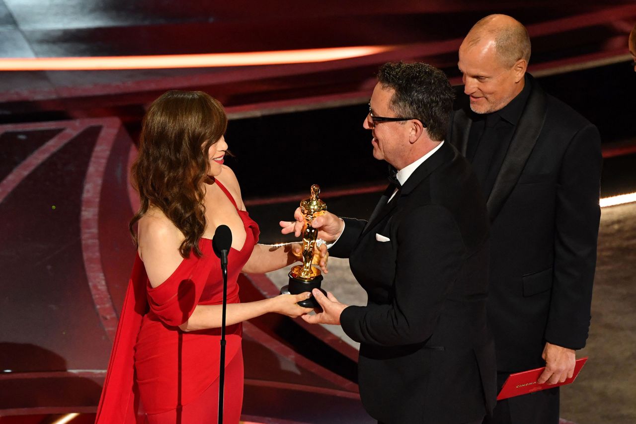 Rosie Perez presents Greig Fraser with the best cinematography Oscar for "Dune." The sci-fi movie dominated many of the technical categories and won six Oscars on the night. No other movie won more.