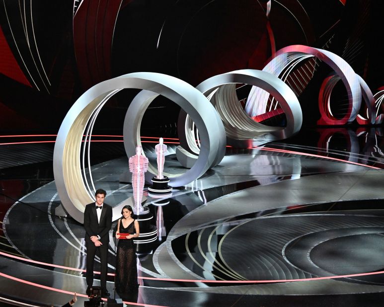 Jacob Elordi and Rachel Zegler present an award during the show. There was a backlash earlier this month when Zegler, the star of "West Side Story," shared that she hadn't been invited to the show. "I never thought that I would be here six days ago," <a href="https://www.cnn.com/entertainment/live-news/oscars-2022/h_67f07c31e474f5ea26d63d9d190cfc46" target="_blank">she joked.</a> "We did it. Dreams really can come true, pretty fast, too."