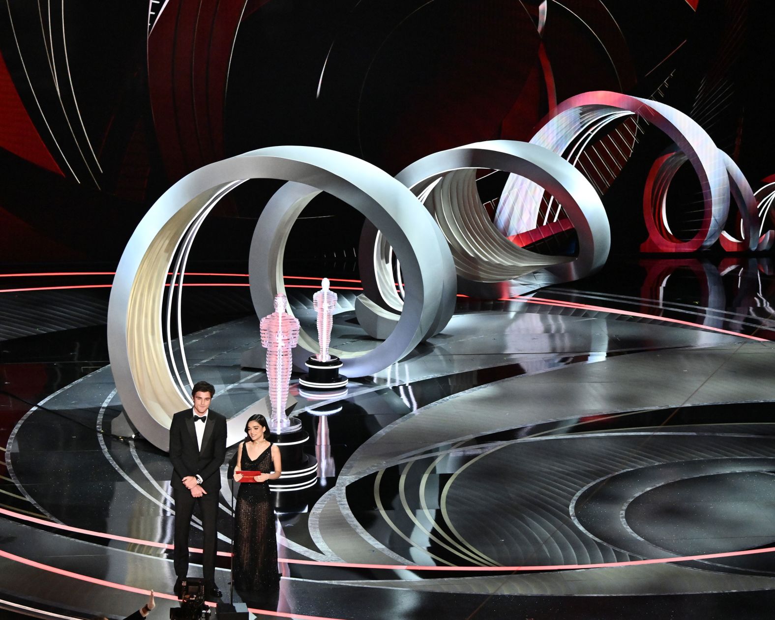 Jacob Elordi and Rachel Zegler present an award during the show. There was a backlash earlier this month when Zegler, the star of "West Side Story," shared that she hadn't been invited to the show. "I never thought that I would be here six days ago," <a href="index.php?page=&url=https%3A%2F%2Fwww.cnn.com%2Fentertainment%2Flive-news%2Foscars-2022%2Fh_67f07c31e474f5ea26d63d9d190cfc46" target="_blank">she joked.</a> "We did it. Dreams really can come true, pretty fast, too."