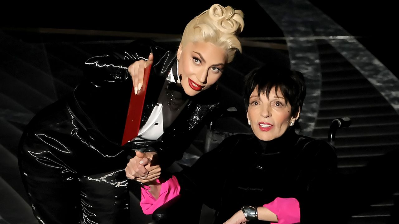 Lady Gaga, left, and Liza Minnelli speak onstage during the annual Academy Awards. A sweet end to a wild show!