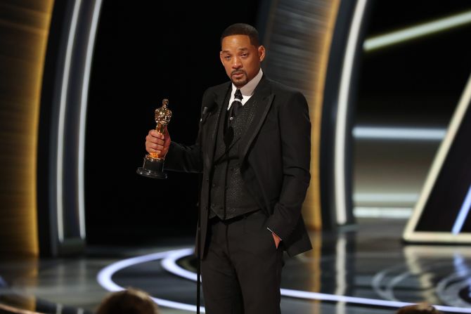 Smith accepts his best actor Oscar. <a href="index.php?page=&url=https%3A%2F%2Fwww.cnn.com%2Fentertainment%2Flive-news%2Foscars-2022%2Fh_0a53cf2f9bfe37c8003829b1f5a069c0" target="_blank">He tearfully accepted the award</a> for his role as Richard Williams, the father of tennis stars Venus and Serena Williams, in the film "King Richard." Smith said Richard Williams "was a fierce defender of his family." He apologized to the Academy for his incident with Rock and said he hoped he would be welcomed back. "Love will make you do crazy things," he said.