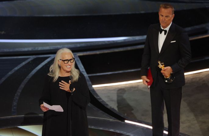 Campion accepts the Oscar after becoming <a href="index.php?page=&url=https%3A%2F%2Fwww.cnn.com%2Fentertainment%2Flive-news%2Foscars-2022%2Fh_63a260520baa46296462276507c50394" target="_blank">the third woman in history to win best director.</a>